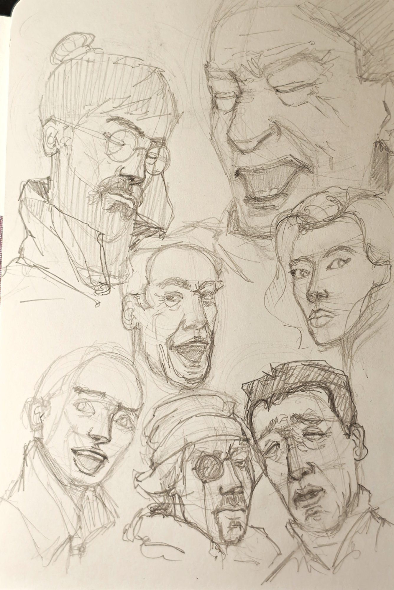 Sketchbook page of quick pencil heads with basic expressions, construction shapes left in place